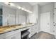 Elegant bathroom with double sinks, granite countertop, vanity area, and plenty of storage space at 3229 Medici Blvd, New Smyrna Beach, FL 32168
