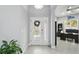 Bright foyer featuring light grey walls, tile flooring and clear view into office area at 3229 Medici Blvd, New Smyrna Beach, FL 32168