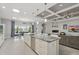 Open concept kitchen with a large island and view of the living and dining areas at 3229 Medici Blvd, New Smyrna Beach, FL 32168