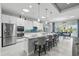 Modern kitchen featuring a large center island with seating and state of the art appliances at 3229 Medici Blvd, New Smyrna Beach, FL 32168