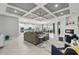 Open-concept living space featuring a stylish tray ceiling, neutral decor, and a cozy fireplace at 3229 Medici Blvd, New Smyrna Beach, FL 32168