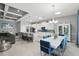 Open-concept living area with a modern kitchen, dining space, and a comfortable seating area at 3229 Medici Blvd, New Smyrna Beach, FL 32168
