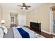 Bedroom featuring a ceiling fan, access to the outside, and en suite bathroom at 3245 S Atlantic Ave # 304, Daytona Beach Shores, FL 32118