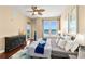 Bedroom with stunning ocean views, hardwood flooring, ceiling fan, and neutral walls at 3245 S Atlantic Ave # 304, Daytona Beach Shores, FL 32118