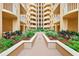 Interior courtyard with lush landscaping and balconies at 3245 S Atlantic Ave # 304, Daytona Beach Shores, FL 32118