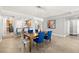 Elegant dining area with modern lighting and an adjacent view of the kitchen at 3245 S Atlantic Ave # 304, Daytona Beach Shores, FL 32118
