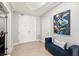 Inviting hallway featuring a blue bench, colorful art and a decorative ceiling feature at 3245 S Atlantic Ave # 304, Daytona Beach Shores, FL 32118