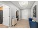 Spacious hallway with tiled floors, recessed lighting, and a decorative table and couch at 3245 S Atlantic Ave # 304, Daytona Beach Shores, FL 32118