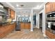 Bright kitchen boasts stainless steel appliances, granite countertops, and view to living area with ocean view at 3245 S Atlantic Ave # 304, Daytona Beach Shores, FL 32118