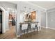 Modern kitchen featuring stainless steel appliances, granite countertops, and stylish barstool seating at 3245 S Atlantic Ave # 304, Daytona Beach Shores, FL 32118