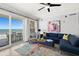 Inviting living room with comfortable seating and scenic ocean views from the sliding glass doors at 3245 S Atlantic Ave # 304, Daytona Beach Shores, FL 32118
