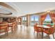 Inviting lounge with tables and chairs, next to the community pool with ocean views at 3245 S Atlantic Ave # 304, Daytona Beach Shores, FL 32118