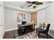 Office space with hardwood floors, natural light, and a black desk at 3245 S Atlantic Ave # 304, Daytona Beach Shores, FL 32118