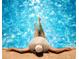 Relaxing in a pool with sparkling water, the bright sun creating a peaceful scene at 3245 S Atlantic Ave # 304, Daytona Beach Shores, FL 32118