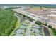 Community aerial with lakes, roadways, and nearby wooded areas at 3322 Modena Way, New Smyrna Beach, FL 32168