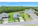 Aerial view of the property featuring a lake and a landscaped yard at 3322 Modena Way, New Smyrna Beach, FL 32168