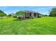A spacious backyard with a well-kept lawn and a screened-in porch, perfect for outdoor living at 3322 Modena Way, New Smyrna Beach, FL 32168