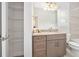 Bathroom featuring granite countertop and wire shelving behind open door at 3322 Modena Way, New Smyrna Beach, FL 32168