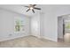 Bright bedroom featuring tile flooring, closet and view to hallway and other rooms at 3322 Modena Way, New Smyrna Beach, FL 32168
