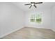 Well-lit bedroom featuring tiled floors and large window letting in ample natural light at 3322 Modena Way, New Smyrna Beach, FL 32168