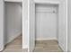 Open closet featuring white trim and wire shelving and tile flooring at 3322 Modena Way, New Smyrna Beach, FL 32168