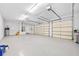 An oversized three-car garage with epoxy floor and two automatic doors at 3322 Modena Way, New Smyrna Beach, FL 32168