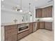 Gourmet kitchen featuring stainless steel appliances, granite countertops, and custom wood cabinetry at 3322 Modena Way, New Smyrna Beach, FL 32168