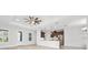 Bright living space with tile floors, tray ceilings, pendant lights, and stainless steel appliances at 3322 Modena Way, New Smyrna Beach, FL 32168