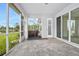 Covered patio features brick pavers, view of a pond, and hot tub at 3322 Modena Way, New Smyrna Beach, FL 32168