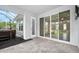 Covered brick patio includes outdoor hot tub and sliding glass doors at 3322 Modena Way, New Smyrna Beach, FL 32168