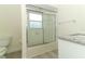 Bathroom with a tiled shower/tub, granite countertop, and ample lighting at 340 Hampton Hills Ct, Debary, FL 32713