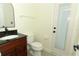 Bathroom features a modern vanity with a dark granite countertop and stylish fixtures at 340 Hampton Hills Ct, Debary, FL 32713