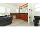 Bathroom featuring a dual sink vanity and dark jacuzzi bathtub at 340 Hampton Hills Ct, Debary, FL 32713