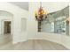 Dining room features a unique glass bay window, light wood flooring, and an elegant chandelier at 340 Hampton Hills Ct, Debary, FL 32713