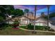 Charming single-story home with lush landscaping, tiled roof, and inviting entryway at 340 Hampton Hills Ct, Debary, FL 32713