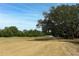 Expansive golf course view featuring lush greenery, trees, and an open fairway at 340 Hampton Hills Ct, Debary, FL 32713