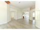 Bright and spacious living room with neutral walls, arched doorways, and modern flooring at 340 Hampton Hills Ct, Debary, FL 32713