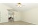 Bright living room with white walls, ceiling fan, and light wood floors at 340 Hampton Hills Ct, Debary, FL 32713