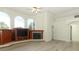Inviting living room with light wood flooring, a fireplace, and multiple windows for ample natural light at 340 Hampton Hills Ct, Debary, FL 32713