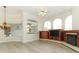 Comfortable living room boasts a fireplace, built-in entertainment center, and light wood flooring at 340 Hampton Hills Ct, Debary, FL 32713