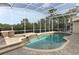 Screened-in in-ground pool and spa with a brick-paved deck at 340 Hampton Hills Ct, Debary, FL 32713