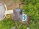 Aerial view of home with a screened pool and solar panels at 400 Landress Ln, Deland, FL 32724