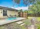 Charming back patio includes a table and a vintage rug, great for outdoor relaxation and entertaining at 400 Landress Ln, Deland, FL 32724