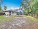 Expansive back yard includes a screened in patio area great for entertaining at 400 Landress Ln, Deland, FL 32724