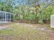 Fenced backyard features mature trees and is perfect for pets to roam at 400 Landress Ln, Deland, FL 32724