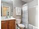 Bathroom featuring a wood vanity, toilet and tub-shower combination at 400 Landress Ln, Deland, FL 32724