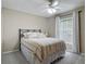 Comfortable bedroom with ceiling fan and a window providing natural light at 400 Landress Ln, Deland, FL 32724
