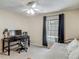 Bedroom featuring a workspace with a desk, a chair, a computer and a window overlooking the pool at 400 Landress Ln, Deland, FL 32724