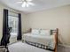 Bright bedroom with a daybed, neutral decor, and natural light at 400 Landress Ln, Deland, FL 32724