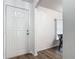 Bright entryway featuring wood-look flooring, a white front door, and white trim throughout at 400 Landress Ln, Deland, FL 32724